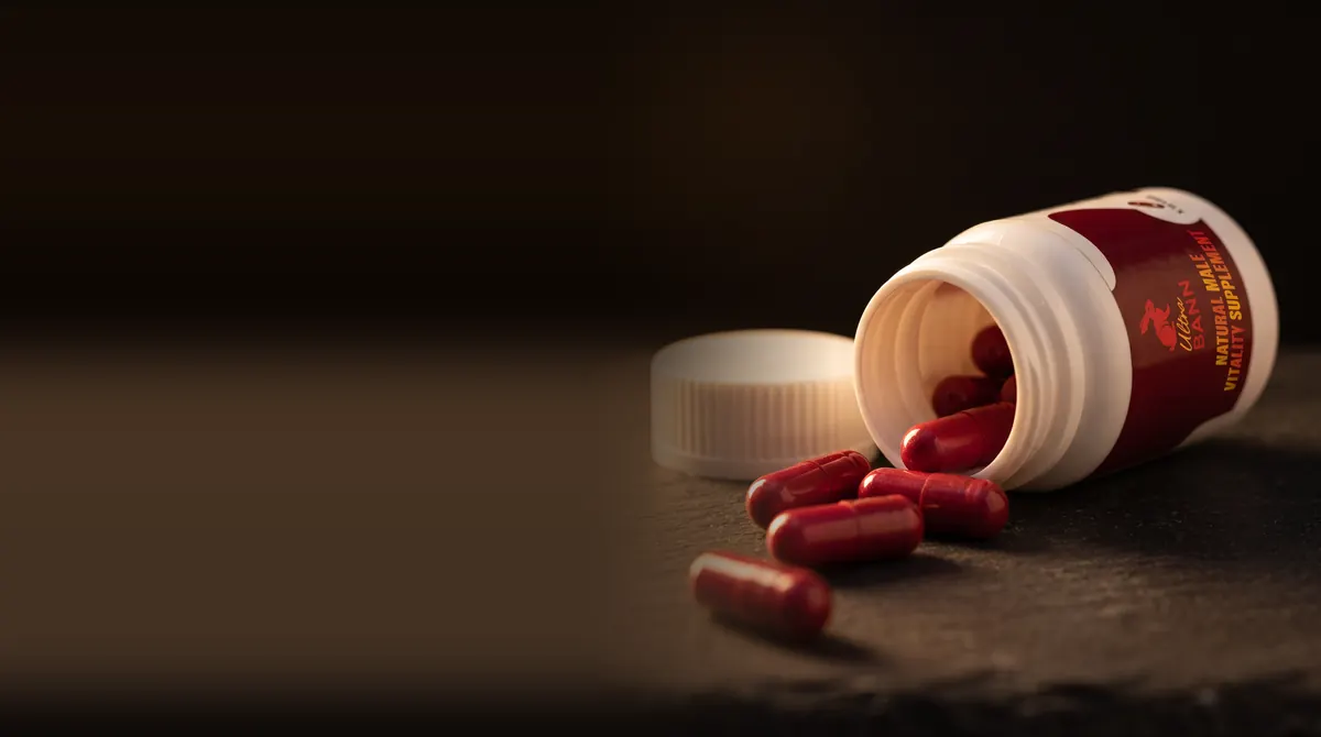 Open Ultra Bann bottle with red capsules